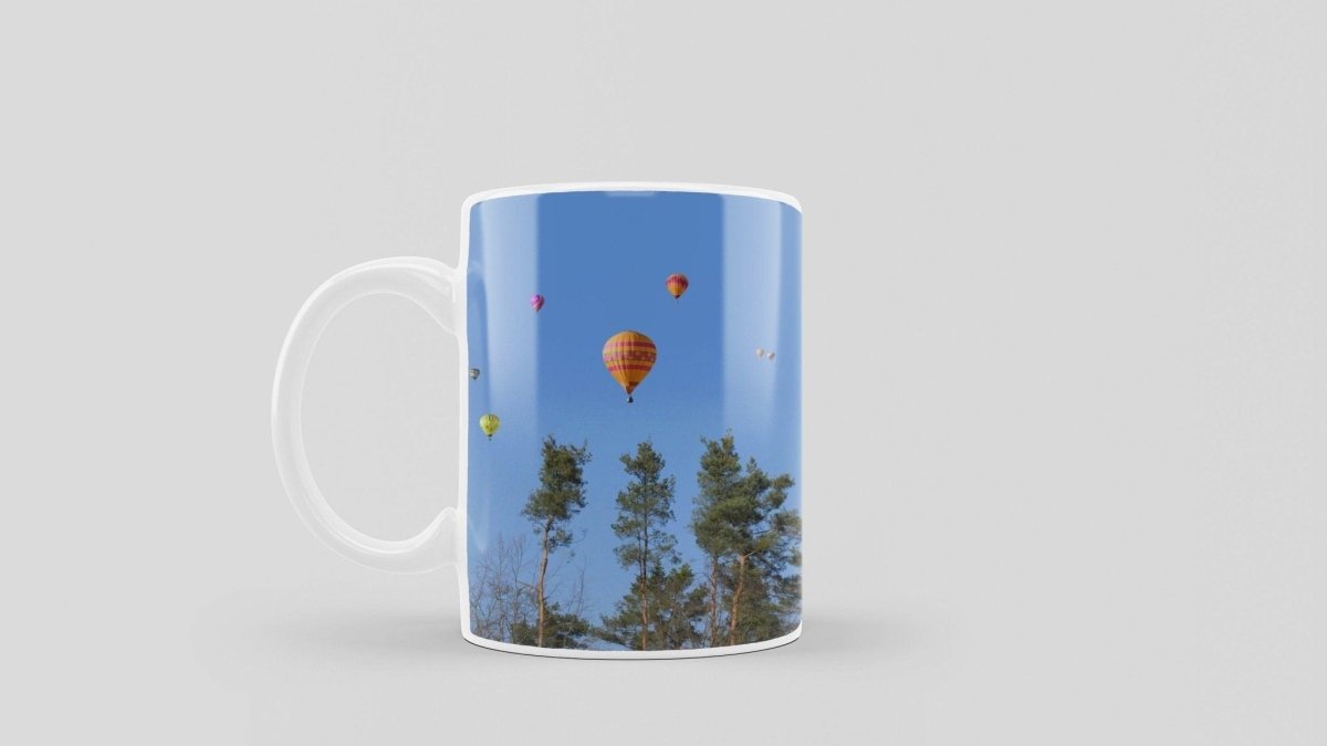 Bedruckte Kaffeetasse mit Feel Free Druck und Heißluftballon Motiv | Tasse aus Keramik - Prami's