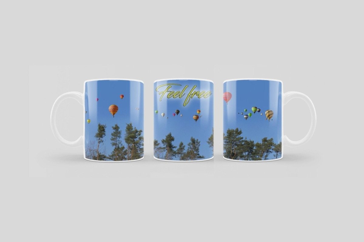 Bedruckte Kaffeetasse mit Feel Free Druck und Heißluftballon Motiv | Tasse aus Keramik - Prami's